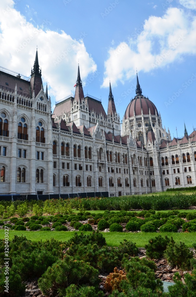 Budapest, Hungary. 08/04/2019. Walls and roof of the Budapest parliament, green lawn. hungarian parliament in budapest