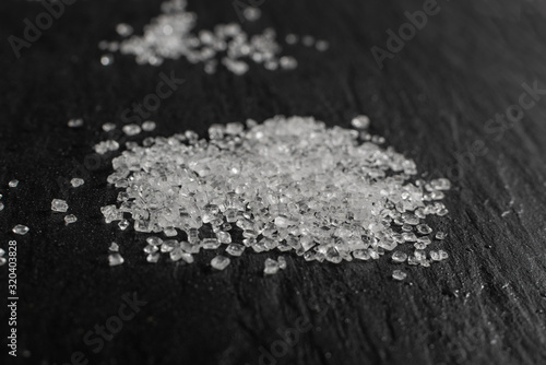 Plastic in granules on black background close up