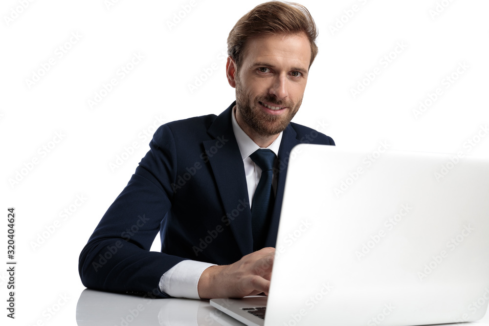 happy young businessman in navy blue suit smiling happy young businessman in navy blue suit smiling