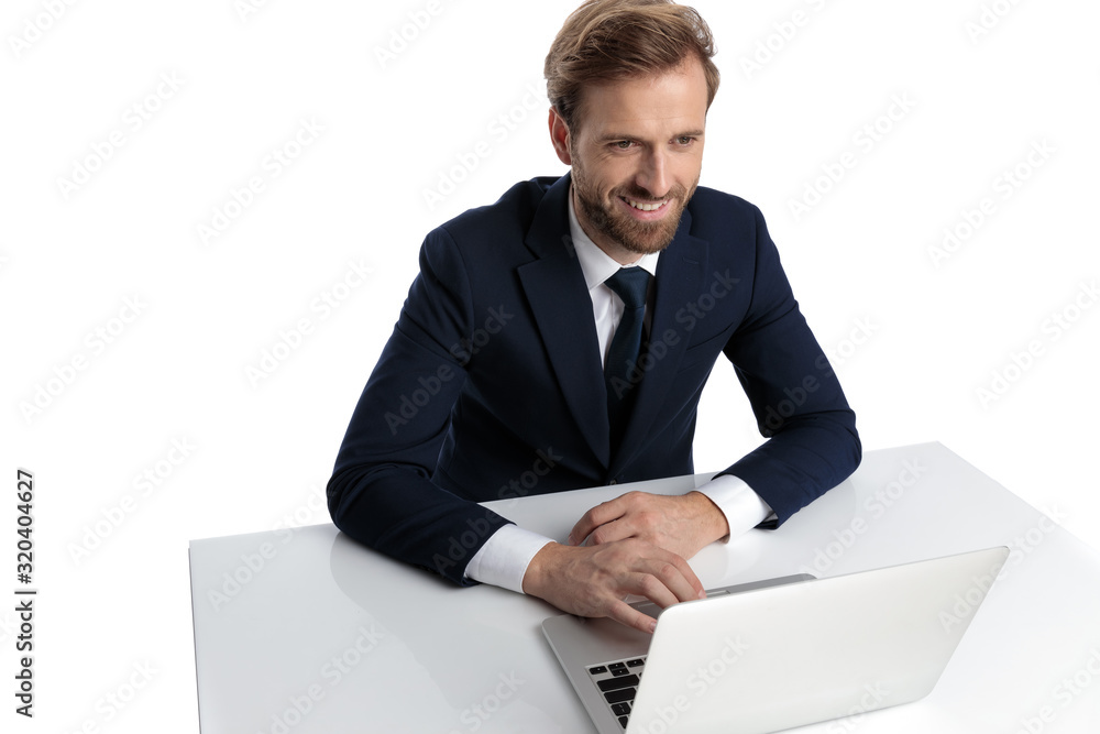 happy young businessman in navy blue suit smiling happy young businessman in navy blue suit smiling