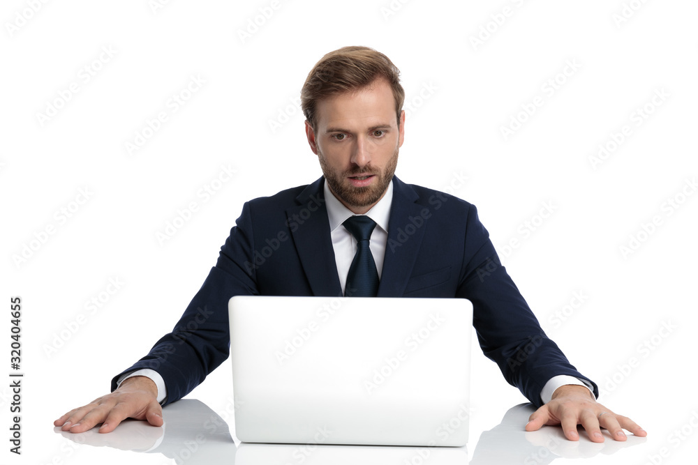 shocked businessman in navy blue suit reading emails shocked businessman in navy blue suit reading emails