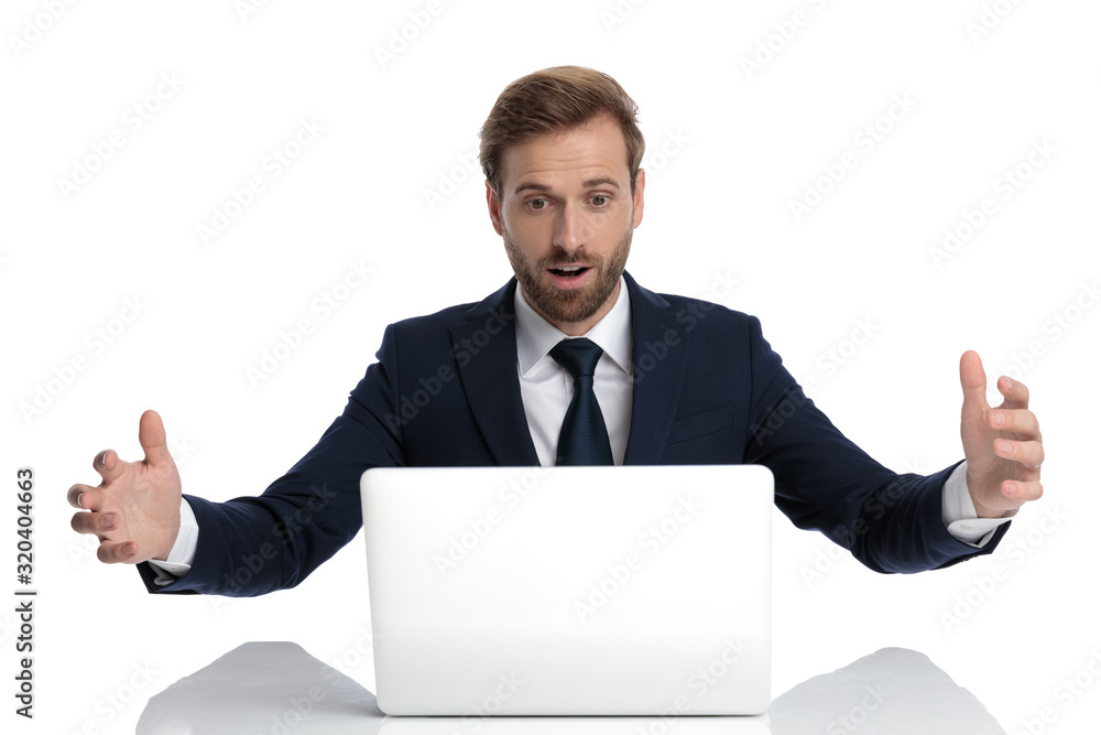 surprised young businessman in navy blue suit reading emails surprised young businessman in navy blue suit reading emails