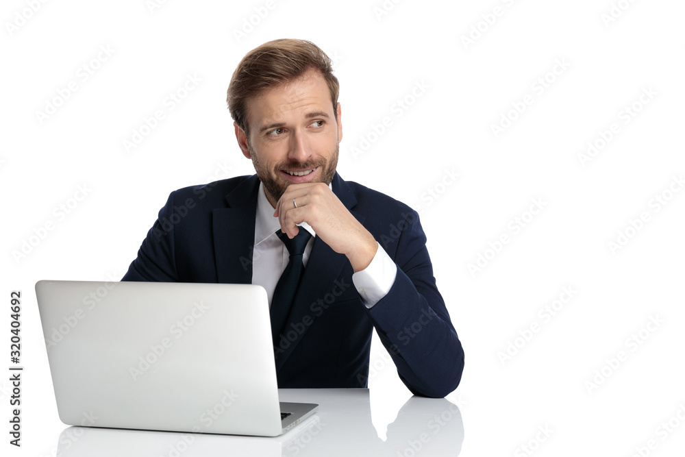 happy businessman smiling and holding hand to chin happy businessman smiling and holding hand to chin