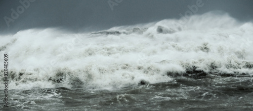 Fototapeta Naklejka Na Ścianę i Meble -  Crashing big sea waves. Gloria storm on the Barcelona coast. The power of the sea.
