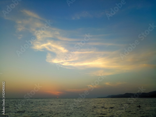 Amazing sea sunset, the sun, waves, clouds