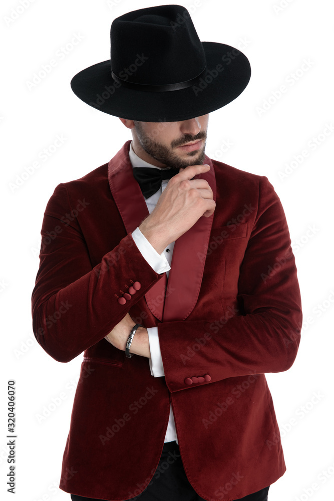 thoughtful fashion model in red velvet tuxedo thinking thoughtful fashion model in red velvet tuxedo thinking