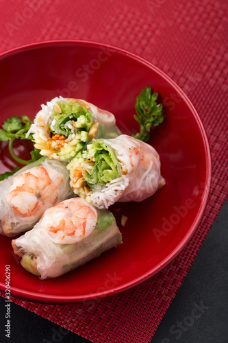 Fresh Vietnamese, Asian, Chinese food. Spring rolls rice paper, lettuce, salad, sweet chili, soy, lemon. Vietnamese spring rolls. Asian and thai food. Traditional national cuisine