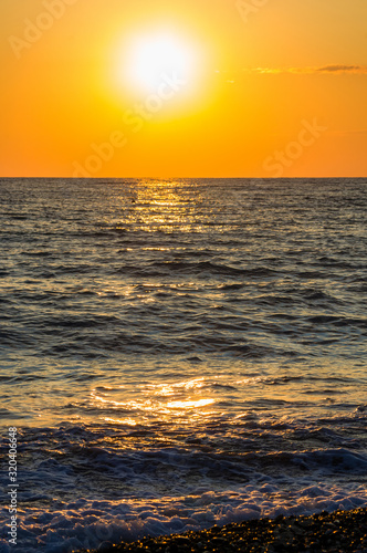 Amazing sea sunset, the sun, waves, clouds