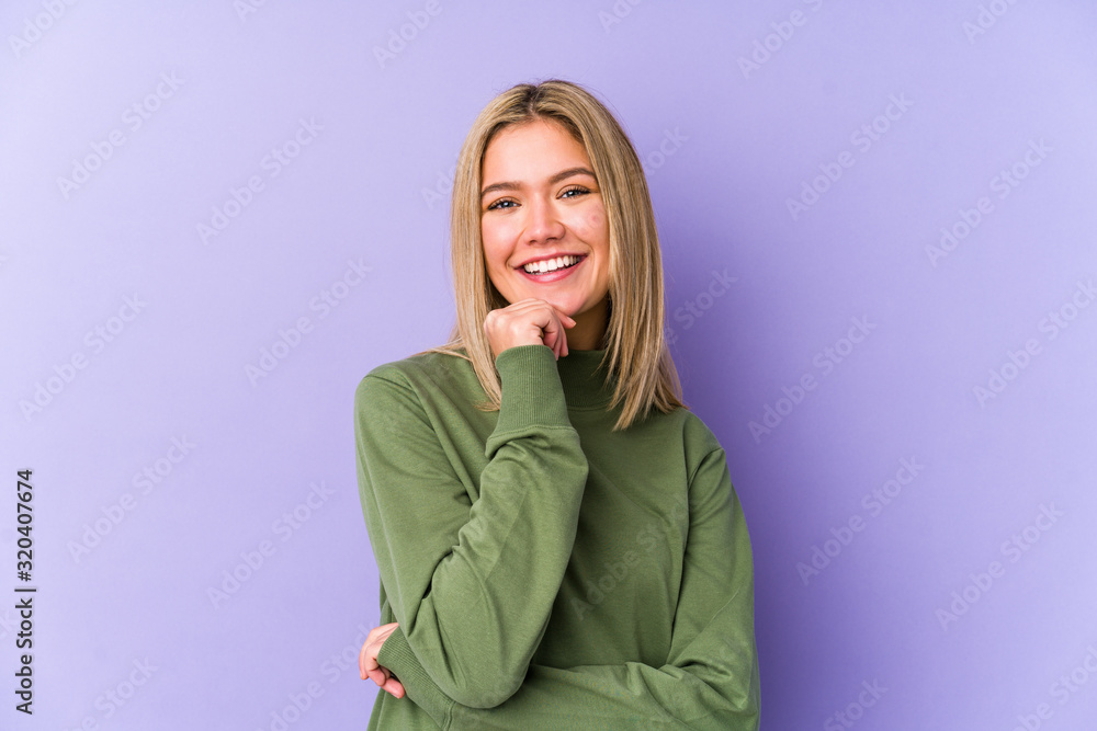 Young blonde caucasian woman isolated smiling happy and confident, touching chin with hand. Young blonde caucasian woman isolated smiling happy and confident, touching chin with hand.