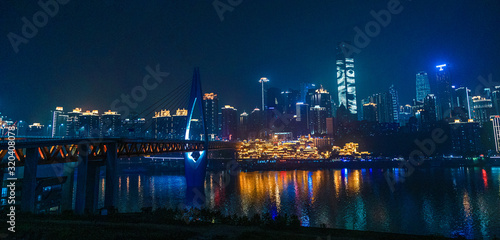 City night view of Chongqing  China.  The scenery by the river.  The fusion of modern architecture and folk architecture.  City view by the water