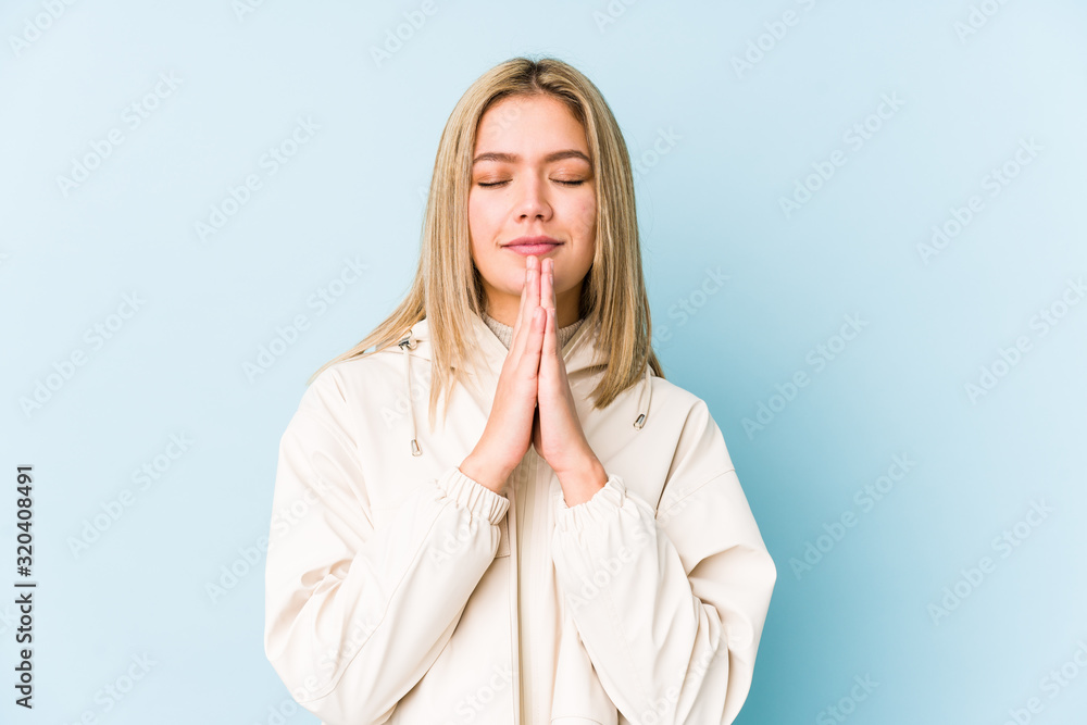 Young blonde caucasian woman isolated showing a timeout gesture.