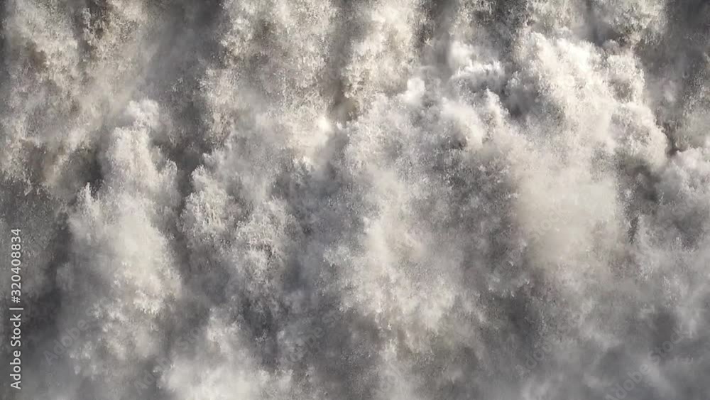 Close-up of a strong and big waterfall in slow motion. Close-up of a strong and big waterfall in slow motion.