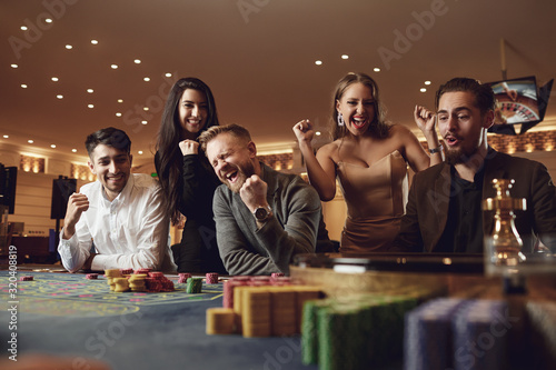 Photography Friends gambling betting in a casino.