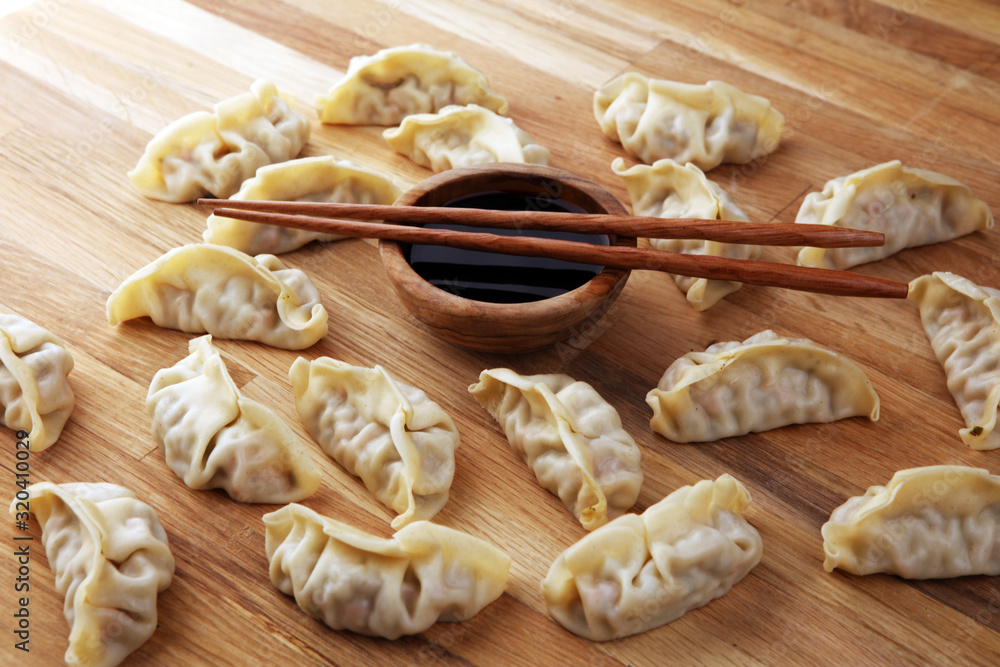 Gyoza or dumplings snack with soy sauce.