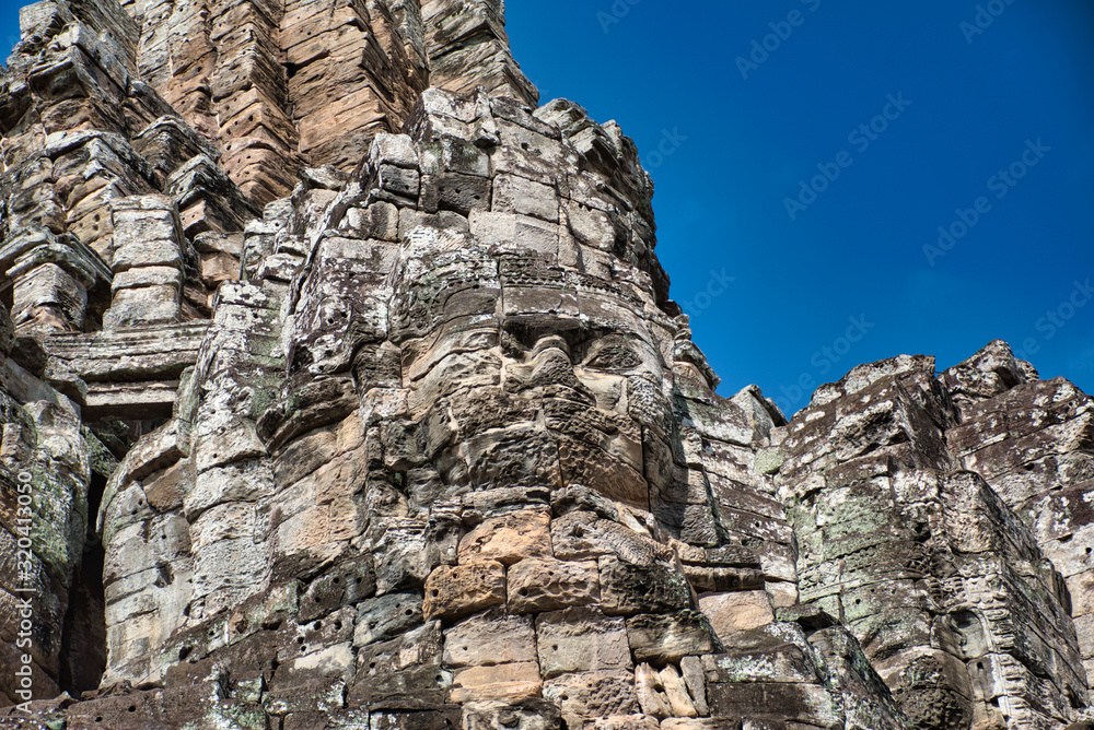 Bayon faces at The Bayon, Prasat Bayon richly decorated Khmer temple