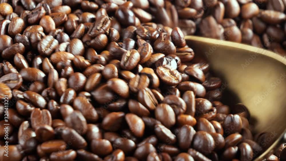 Black coffee beans roast in a pan in the smoke Black coffee beans roast in a pan in the smoke