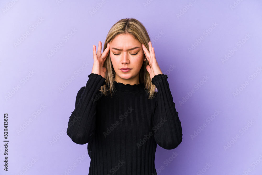 Young blonde caucasian woman isolated touching temples and having headache. Young blonde caucasian woman isolated touching temples and having headache.