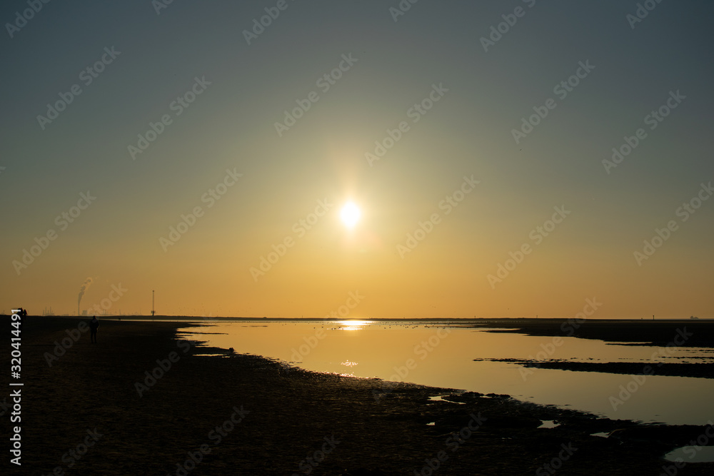 Sunset on a beach in Noordwijk aan zee, Netherlands Sunset on a beach in Noordwijk aan zee, Netherlands