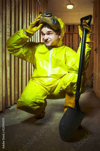 Apocalyptic man in nightmare style posing with gasmask photo