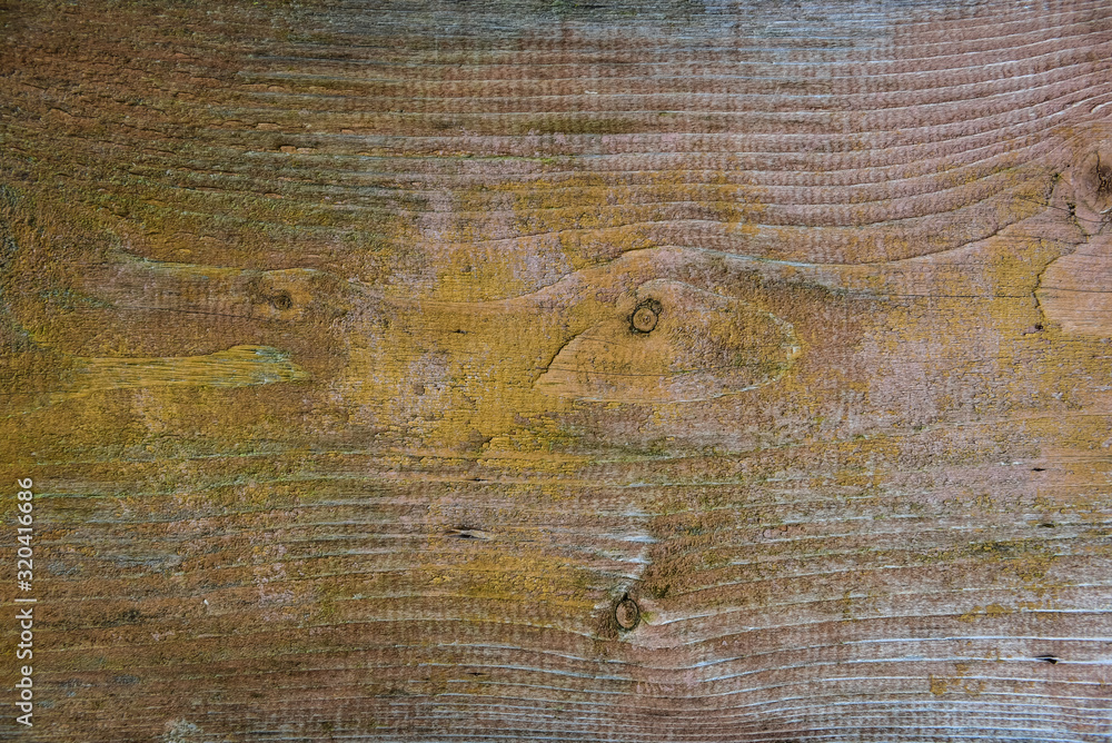 Old wooden board weathered grunge surface with cracked and peeling paint close up as background. Old wooden board weathered grunge surface with cracked and peeling paint close up as background.