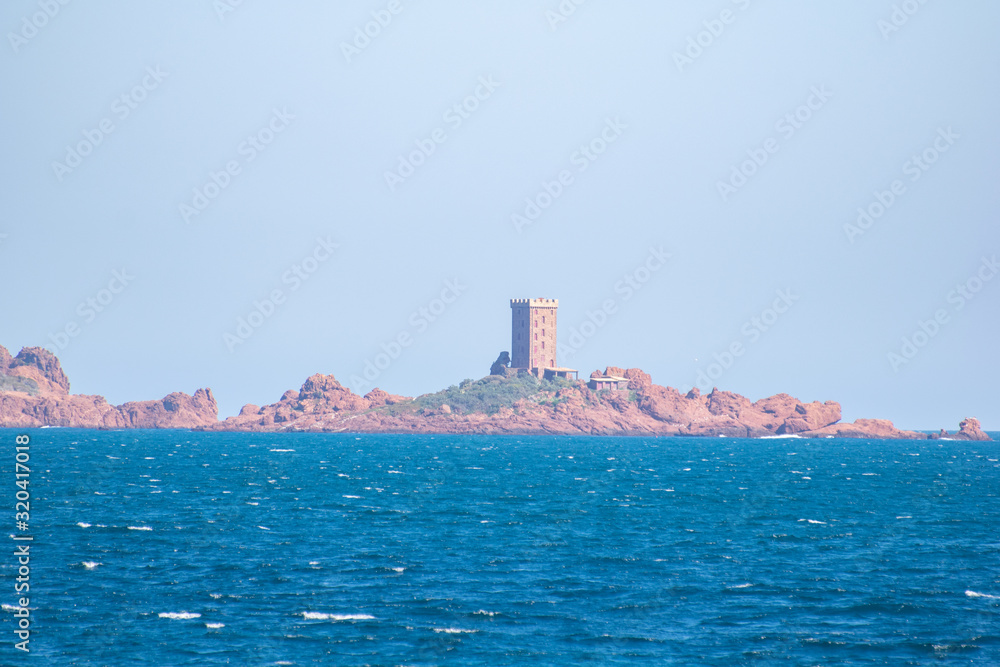 Island in the distance with a prison tower on top Island in the distance with a prison tower on top