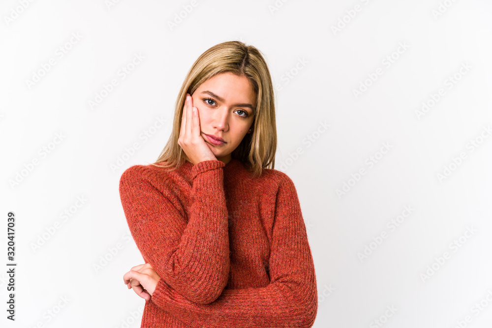 Young blonde caucasian woman isolated who is bored, fatigued and need a relax day. Young blonde caucasian woman isolated who is bored, fatigued and need a relax day.