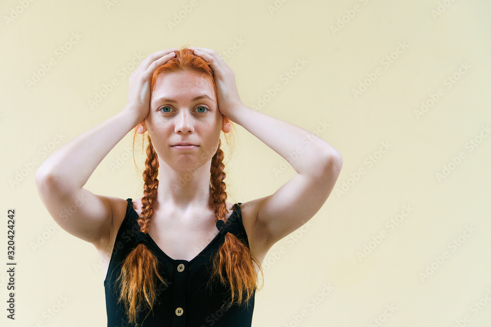 Beautiful restless girl holding her head. Turmoil and fuss concept with copyspace. Beautiful restless girl holding her head. Turmoil and fuss concept with copyspace.