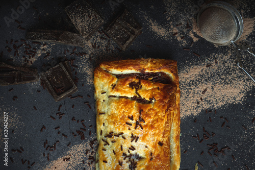 Sweet puff pastry stuffed with chocolate. Cooking background. Still life of delicious desserts