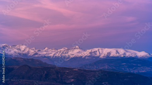 Sunset over snowy mountains