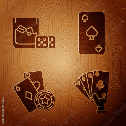 Set Hand holding playing cards, Game dice and glass of whiskey with ice cubes, Casino chip and playing cards and Playing card with spades symbol on wooden background. Vector