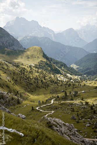 Hike the mountains of Passo Giau. The world famous Dolomites peaks in South Tyrol in the Alps of Italy. Belluno in Europe mountain scenery. Green pasture