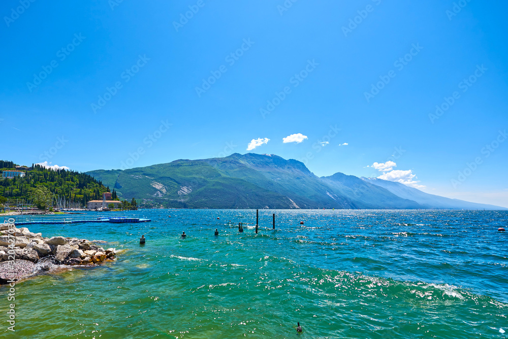 Coast of the gorgeous Lake Garda surrounded by mountains in Riva del Garda, Italy. Coast of the gorgeous Lake Garda surrounded by mountains in Riva del Garda, Italy.