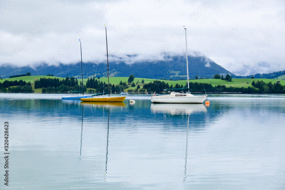 Fussen, Baviera / Germany - July 29, 2019: Forggensee lake in Fussen Fussen, Baviera / Germany - July 29, 2019: Forggensee lake in Fussen