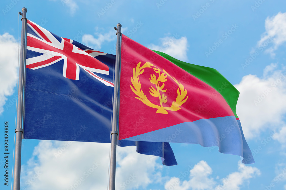 Eritrea and Anguilla flags waving in the wind against white cloudy blue sky together. Diplomacy concept, international relations. Eritrea and Anguilla flags waving in the wind against white cloudy blue sky together. Diplomacy concept, international relations.