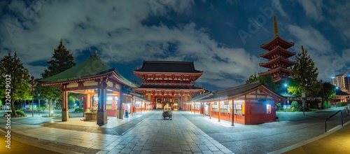 Japan. Asakusa Temple in Tokyo at night.  Panorama of Asakusa district. Night panorama of the temple of the three deities. Evening Tokyo. Sights of Japan. Tub of water in front of Sensoji Temple photo