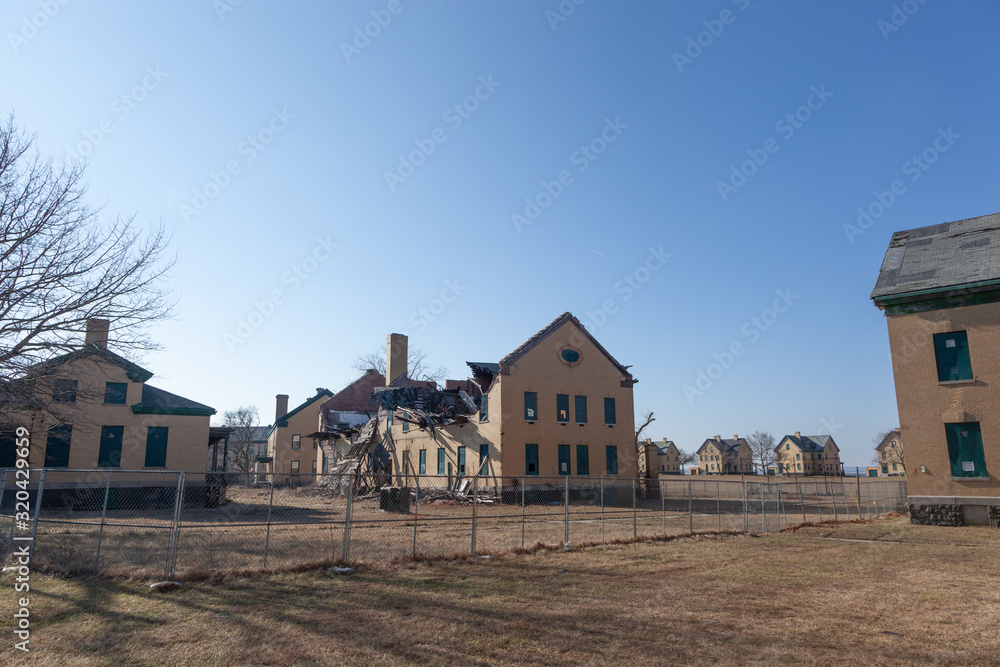 A view of some of the dilapidated buildings at Fort Hancock in Sandy Hook, New Jersey. Officers Row can be seen in the background. A view of some of the dilapidated buildings at Fort Hancock in Sandy Hook, New Jersey. Officers Row can be seen in the background.