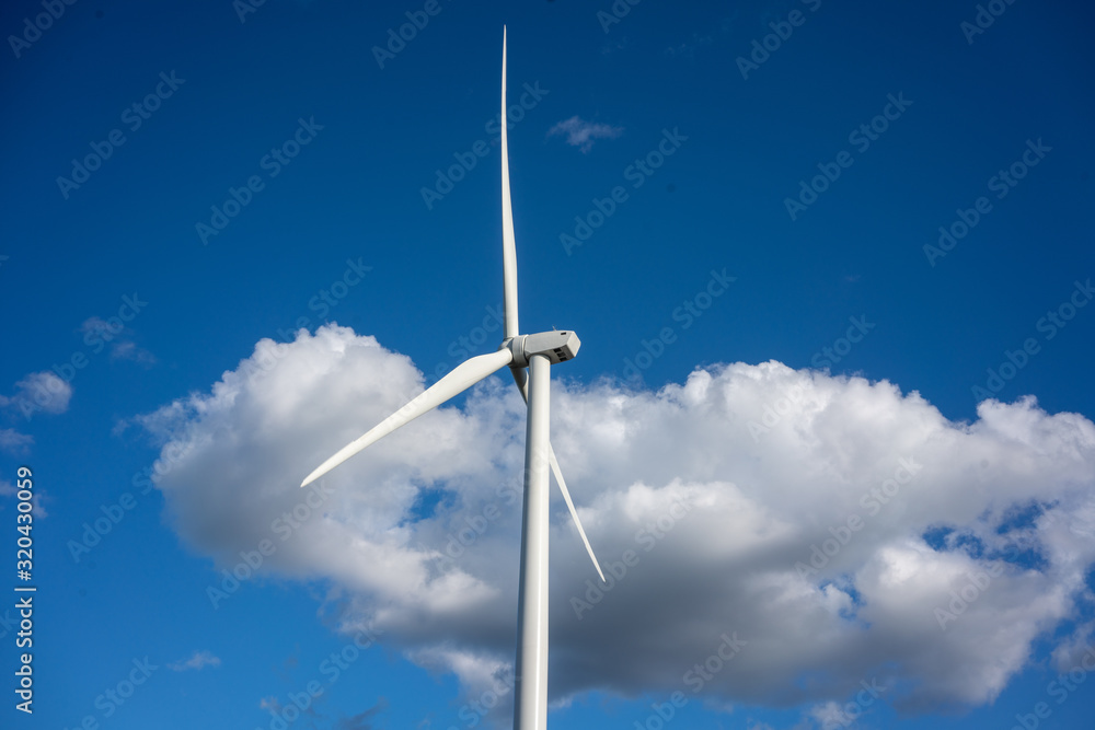 Wind turbine against blue sky Wind turbine against blue sky