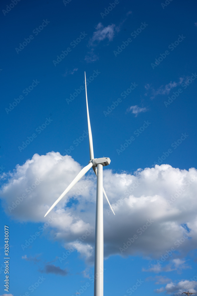 Wind turbine against blue sky Wind turbine against blue sky