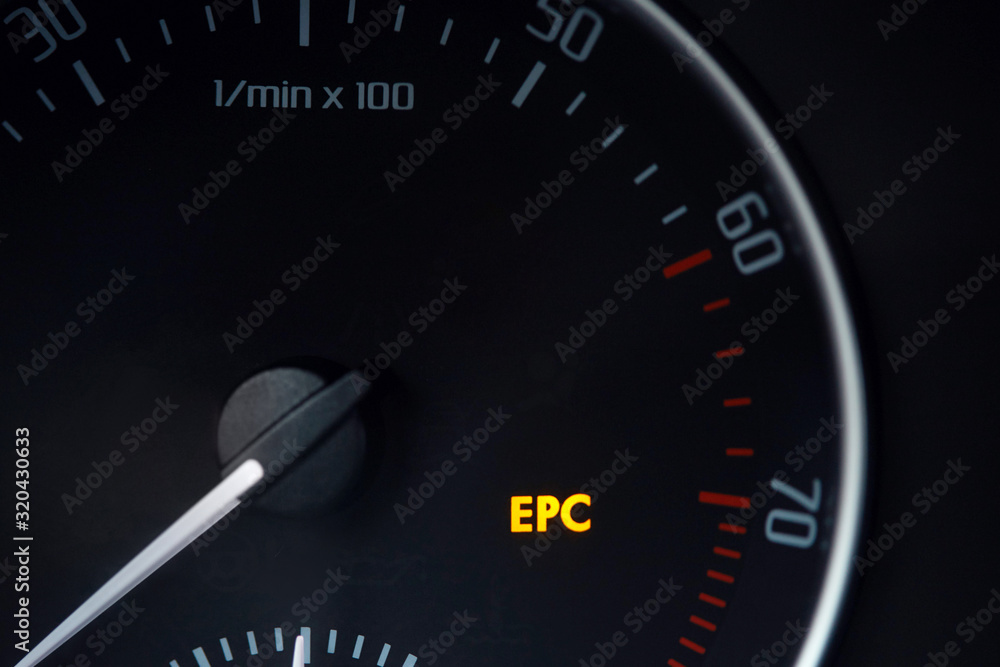 Tachometer dial with needle showing zero rpm with diagnostic icons