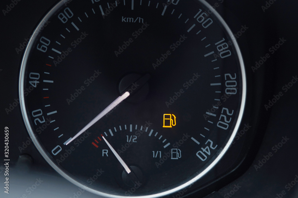 Empty fuel gauge warning light in car dashboard Empty fuel gauge warning light in car dashboard