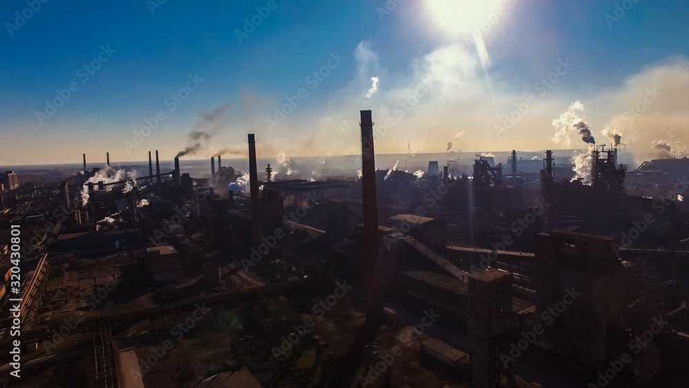 Metallurgical plant old environmental change smoke from factory chimney.