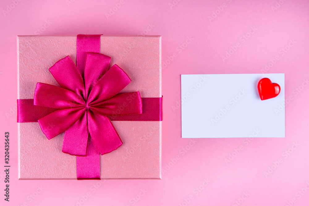 Present with Love note with red heart on pink background mock up, copyspace Present with Love note with red heart on pink background mock up, copyspace