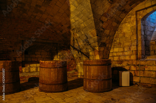Wooden wine barrels in old underground cellar