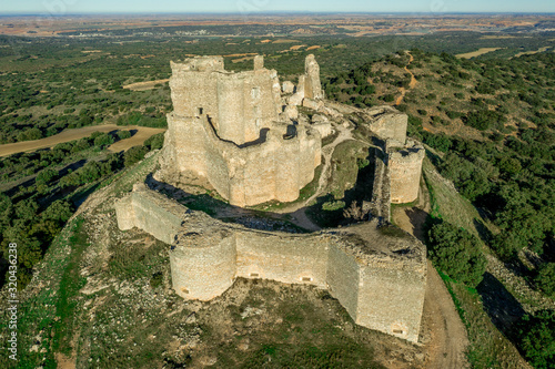 Aerial view of medieval castle ruin Pueble de Almenara in Cuenca Spain with convenctric walls, semicircular towers and angle bastions photo