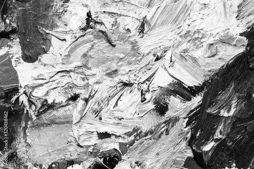 black and white contrasting background of oil paints