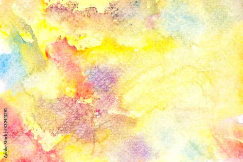 yellow watercolor paint on paper