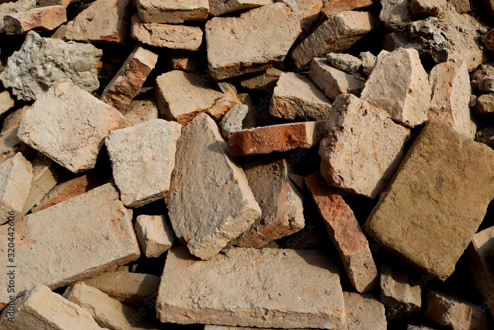 rubble with broken brick pieces from a destroyed wall rubble with broken brick pieces from a destroyed wall
