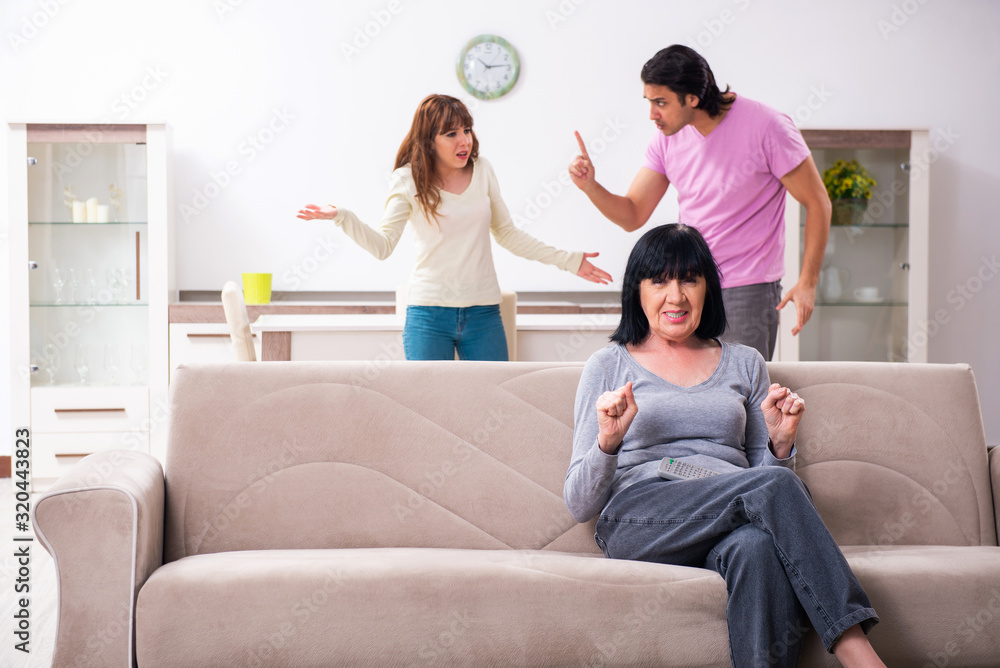 Young family and mother-in-law in family issues concept