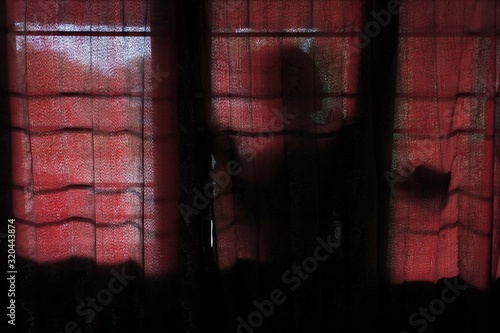 the mysterious silhouette of a woman as an atmosphere of horror