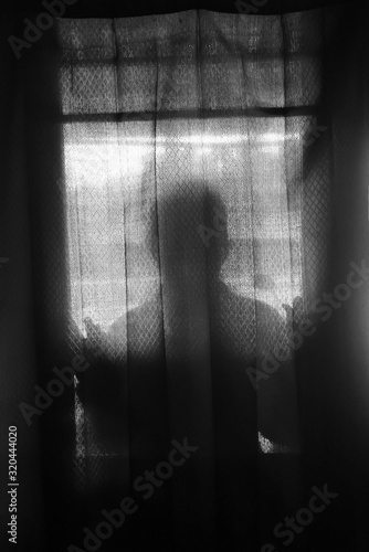 the mysterious silhouette of a woman as an atmosphere of horror